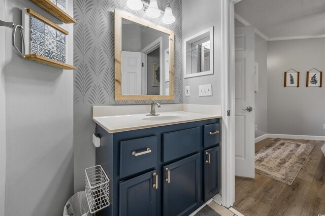 1984 Green Fern Ln Unit 1984, Myrtle Beach, SC 29579 - bathroom featuring crown molding, wallpapered walls, wood finished floors, and vanity