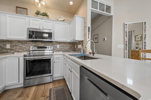 1984 Green Fern Ln Unit 1984, Myrtle Beach, SC 29579 - kitchen with stainless steel appliances, light countertops, decorative backsplash, white cabinetry, and recessed lighting