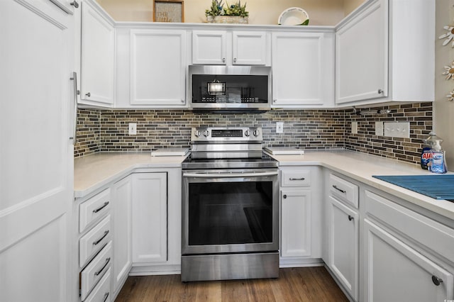 1984 Green Fern Ln Unit 1984, Myrtle Beach, SC 29579 - kitchen with stainless steel appliances, light countertops, white cabinetry, and decorative backsplash