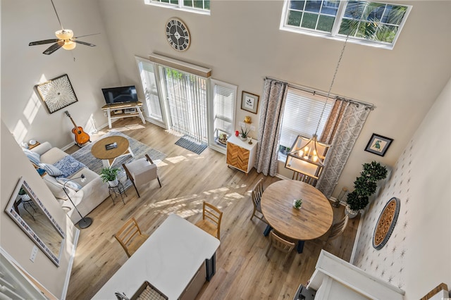 1984 Green Fern Ln Unit 1984, Myrtle Beach, SC 29579 - living room featuring a high ceiling, wood finished floors, a chandelier, and a ceiling fan