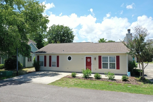 950 Tiffany Ln, North Myrtle Beach, SC 29582 - ranch-style home with concrete driveway, a chimney, and roof with shingles