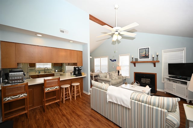950 Tiffany Ln, North Myrtle Beach, SC 29582 - living area with ceiling fan, dark wood-style floors, high vaulted ceiling, and a fireplace