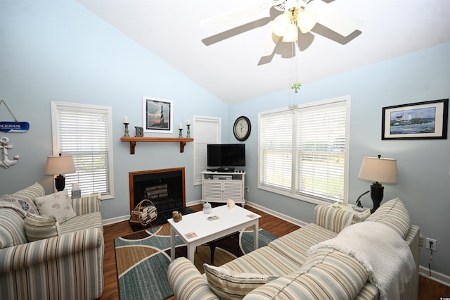 950 Tiffany Ln, North Myrtle Beach, SC 29582 - living area featuring healthy amount of natural light, a ceiling fan, dark wood finished floors, a fireplace with flush hearth, and high vaulted ceiling