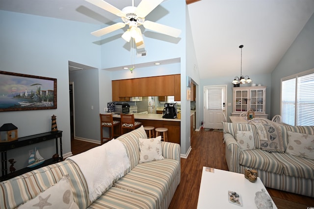 950 Tiffany Ln, North Myrtle Beach, SC 29582 - living room with high vaulted ceiling, ceiling fan, dark wood-type flooring, and a chandelier