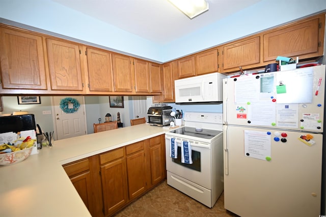 950 Tiffany Ln, North Myrtle Beach, SC 29582 - kitchen with white appliances, light countertops, brown cabinetry, and a peninsula