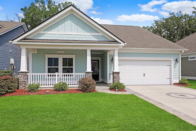 865 Summer Starling Pl, Myrtle Beach, SC 29577 - craftsman-style home with covered porch, a front yard, driveway, a garage, and roof with shingles