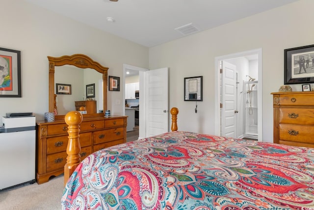 1029 Saltgrass Way, Myrtle Beach, SC 29588 - bedroom with connected bathroom and light carpet