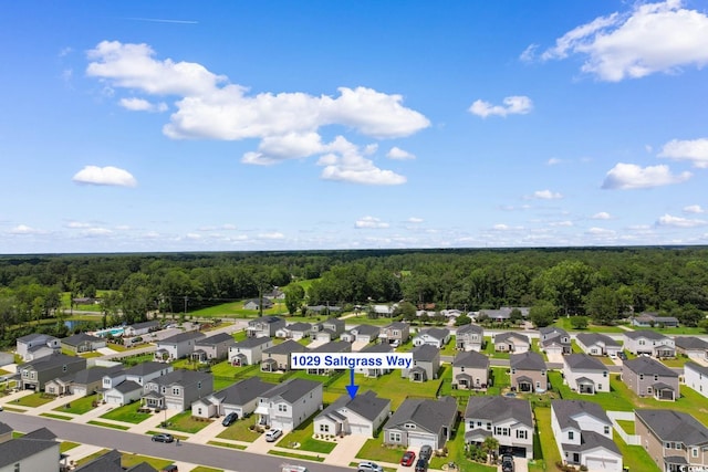 1029 Saltgrass Way, Myrtle Beach, SC 29588 - aerial perspective of suburban area featuring a heavily wooded area