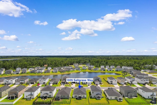 1029 Saltgrass Way, Myrtle Beach, SC 29588 - aerial perspective of suburban area featuring a heavily wooded area and a large body of water