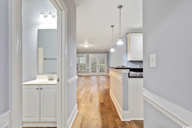 118 Birch N Coppice Dr Unit 2, Surfside Beach, SC 29575 - hall featuring french doors, light wood-type flooring, and crown molding