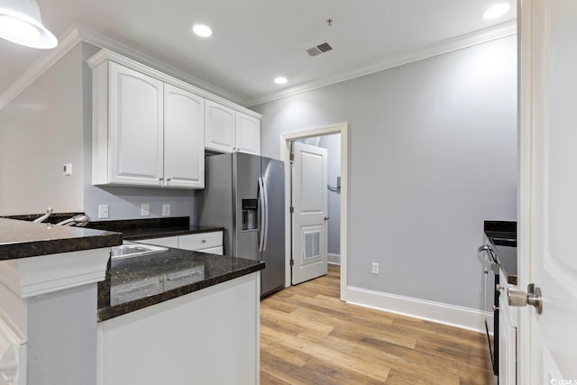 118 Birch N Coppice Dr Unit 2, Surfside Beach, SC 29575 - kitchen with stainless steel refrigerator with ice dispenser, white cabinetry, ornamental molding, a peninsula, and light wood-style flooring