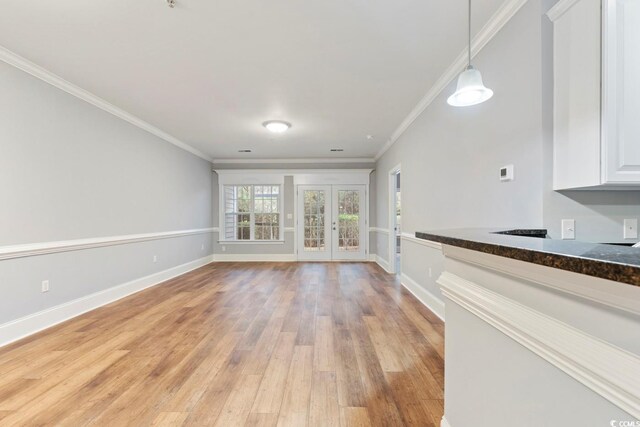 118 Birch N Coppice Dr Unit 2, Surfside Beach, SC 29575 - unfurnished living room featuring french doors, light wood finished floors, and ornamental molding