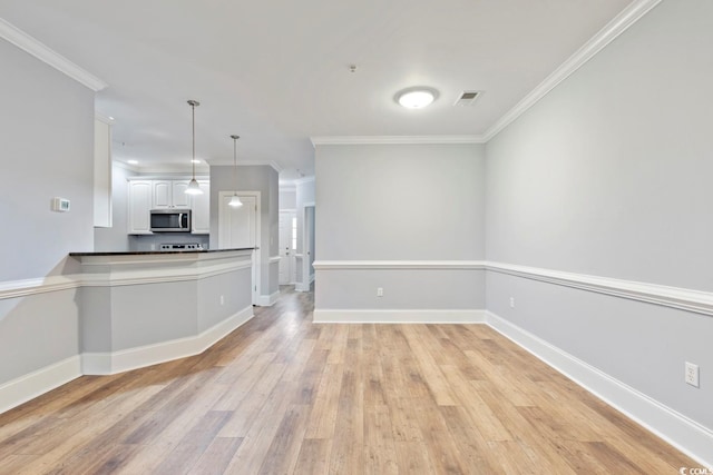 118 Birch N Coppice Dr Unit 2, Surfside Beach, SC 29575 - unfurnished living room with light wood-style flooring and crown molding