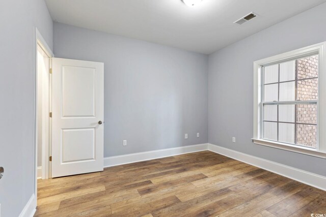 118 Birch N Coppice Dr Unit 2, Surfside Beach, SC 29575 - empty room featuring wood finished floors