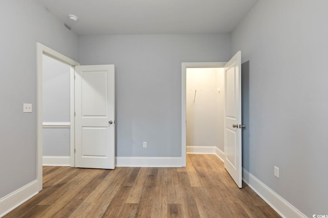 118 Birch N Coppice Dr Unit 2, Surfside Beach, SC 29575 - unfurnished bedroom with wood finished floors and baseboards