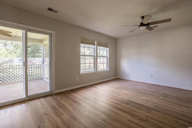 1897 Mossberg Dr, Sumter, SC 29150 - unfurnished room with ceiling fan, wood finished floors, and a textured ceiling