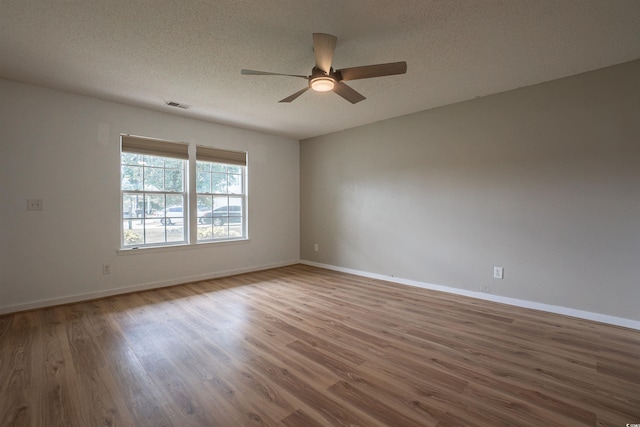 1897 Mossberg Dr, Sumter, SC 29150 - spare room with a ceiling fan, wood finished floors, and a textured ceiling