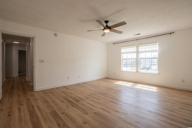1897 Mossberg Dr, Sumter, SC 29150 - unfurnished room featuring a textured ceiling, wood finished floors, and a ceiling fan