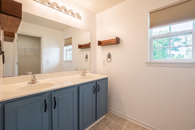1897 Mossberg Dr, Sumter, SC 29150 - bathroom with plenty of natural light, double vanity, and a spacious closet