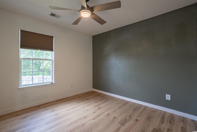 1897 Mossberg Dr, Sumter, SC 29150 - empty room with light wood finished floors and a ceiling fan