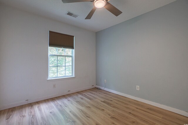 1897 Mossberg Dr, Sumter, SC 29150 - empty room with light wood finished floors and ceiling fan