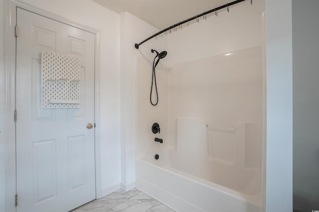 1897 Mossberg Dr, Sumter, SC 29150 - full bathroom with marble look tiles, tub / shower combination, and a textured ceiling