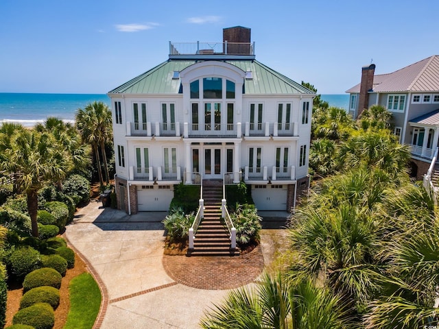 100 Ocean Park Loop, Georgetown, SC 29440 - raised beach house with french doors, a standing seam roof, a balcony, an attached garage, and a water view