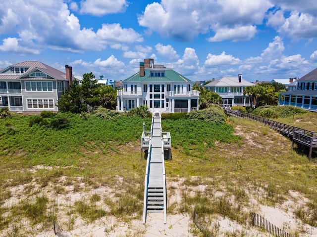 100 Ocean Park Loop, Georgetown, SC 29440 - rear view of property with a chimney, a metal roof, stairs, and a balcony