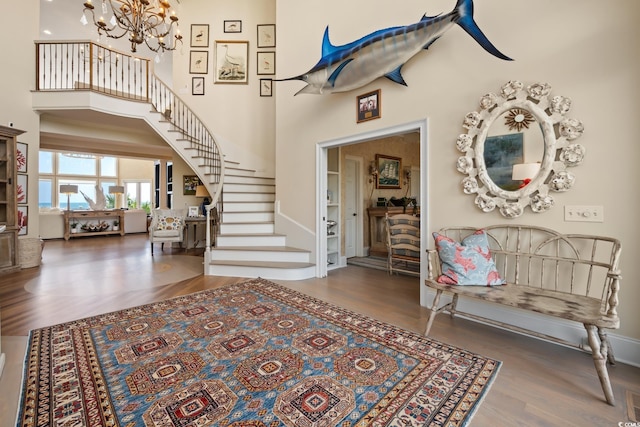 100 Ocean Park Loop, Georgetown, SC 29440 - foyer featuring stairway, wood finished floors, a chandelier, and a towering ceiling