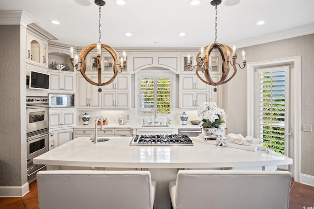 100 Ocean Park Loop, Georgetown, SC 29440 - kitchen with a chandelier, stainless steel appliances, an island with sink, plenty of natural light, and crown molding