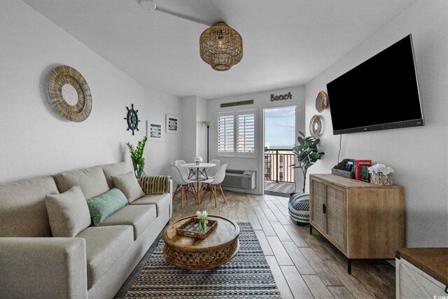 2001 S Ocean Blvd Unit 1405, Myrtle Beach, SC 29577 - living room featuring wood finished floors and a wall unit AC