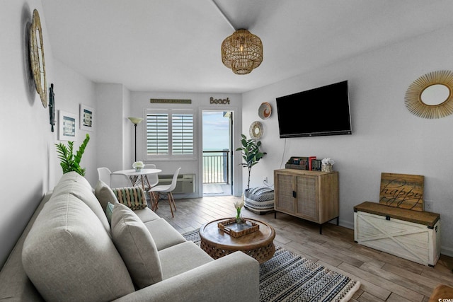 2001 S Ocean Blvd Unit 1405, Myrtle Beach, SC 29577 - living room with wood finished floors and a wall mounted AC