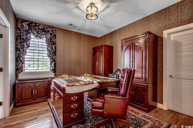 1473 Basin Trl, Murrells Inlet, SC 29576 - office space featuring a textured ceiling, light wood finished floors, and wallpapered walls
