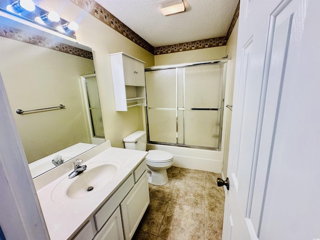 3978 Tybre Downs Cir Unit 3978, Little River, SC 29566 - bathroom featuring vanity, a textured ceiling, shower / bath combination with glass door, and tile patterned flooring