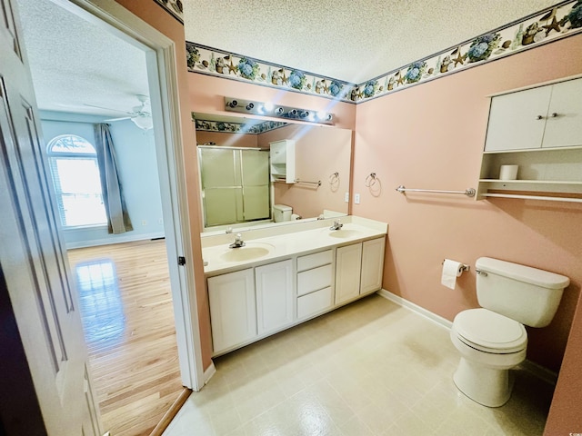 3978 Tybre Downs Cir Unit 3978, Little River, SC 29566 - bathroom with a textured ceiling, a stall shower, double vanity, and ceiling fan