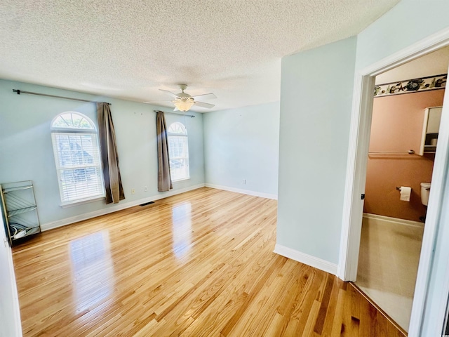 3978 Tybre Downs Cir Unit 3978, Little River, SC 29566 - unfurnished room featuring a textured ceiling, a ceiling fan, and light wood finished floors