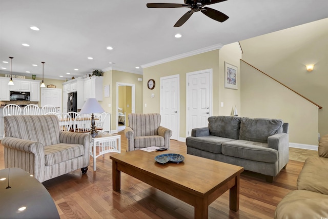 421 30th Ave S, Sunset Beach, NC 28468 - living area with ceiling fan, ornamental molding, recessed lighting, and wood finished floors