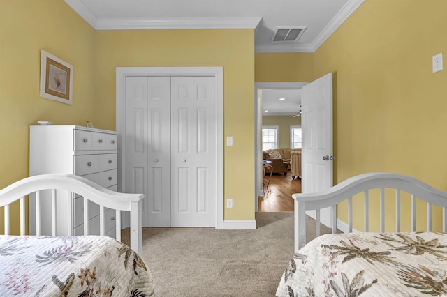 421 30th Ave S, Sunset Beach, NC 28468 - carpeted bedroom with ornamental molding and a closet