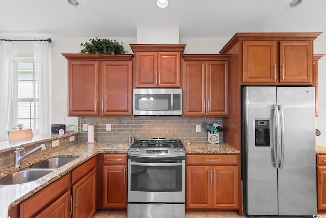 637 Grand Cypress Way, Murrells Inlet, SC 29576 - kitchen with stainless steel appliances, light stone countertops, decorative backsplash, brown cabinets, and recessed lighting
