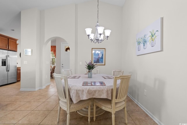 637 Grand Cypress Way, Murrells Inlet, SC 29576 - dining room with arched walkways, light tile patterned floors, high vaulted ceiling, and a chandelier