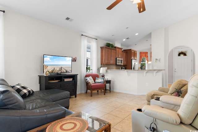 637 Grand Cypress Way, Murrells Inlet, SC 29576 - living room featuring a ceiling fan, light tile patterned floors, arched walkways, lofted ceiling, and recessed lighting