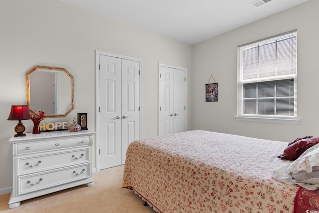 637 Grand Cypress Way, Murrells Inlet, SC 29576 - bedroom with multiple closets and light colored carpet