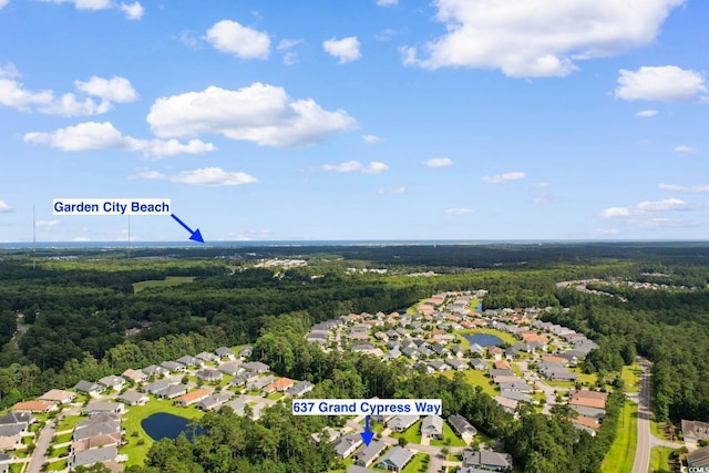 637 Grand Cypress Way, Murrells Inlet, SC 29576 - aerial overview of property's location with a heavily wooded area and nearby suburban area