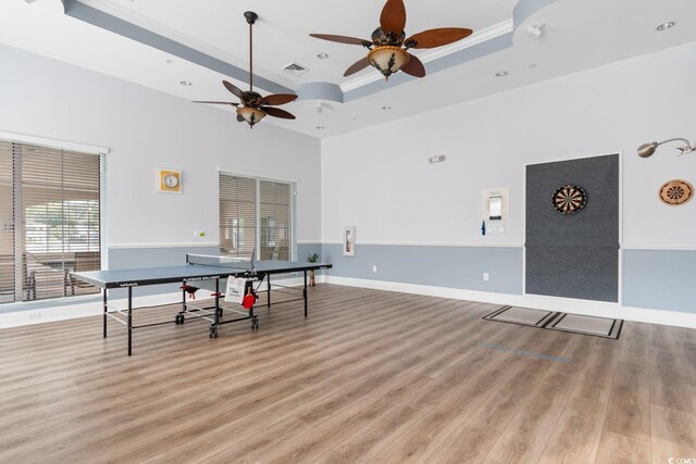 637 Grand Cypress Way, Murrells Inlet, SC 29576 - recreation room featuring crown molding, a raised ceiling, a ceiling fan, light wood-style floors, and recessed lighting