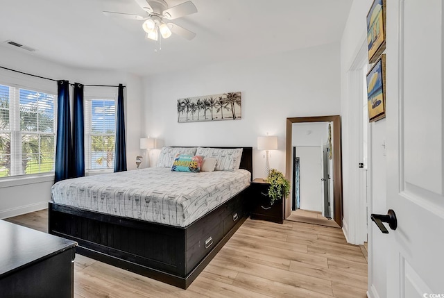 4821 Luster Leaf Cir Unit 202, Myrtle Beach, SC 29577 - bedroom with light wood-style flooring and a ceiling fan