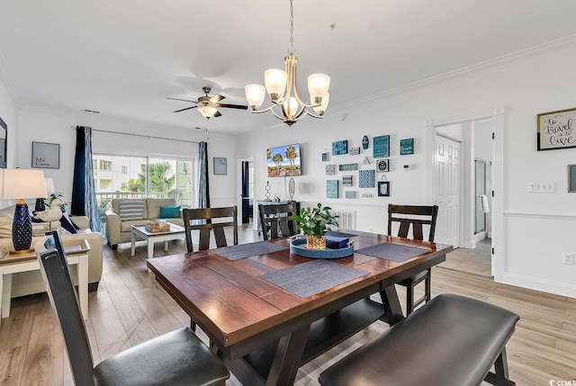 4821 Luster Leaf Cir Unit 202, Myrtle Beach, SC 29577 - dining area with a chandelier, crown molding, ceiling fan, and light wood-style floors