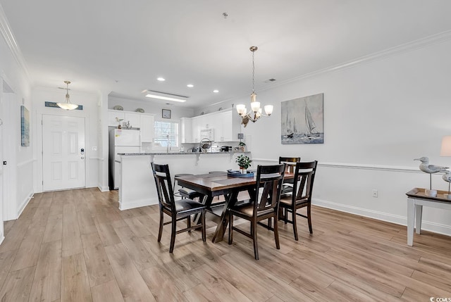 4821 Luster Leaf Cir Unit 202, Myrtle Beach, SC 29577 - dining space featuring ornamental molding, light wood-style flooring, a chandelier, and recessed lighting