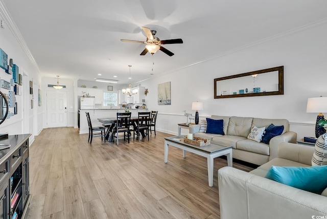 4821 Luster Leaf Cir Unit 202, Myrtle Beach, SC 29577 - living area with a ceiling fan, crown molding, light wood-style floors, and a chandelier