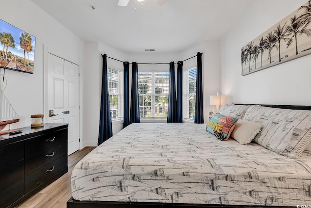 4821 Luster Leaf Cir Unit 202, Myrtle Beach, SC 29577 - bedroom featuring wood finished floors and a ceiling fan
