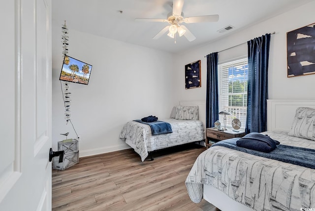 4821 Luster Leaf Cir Unit 202, Myrtle Beach, SC 29577 - bedroom featuring light wood finished floors and a ceiling fan